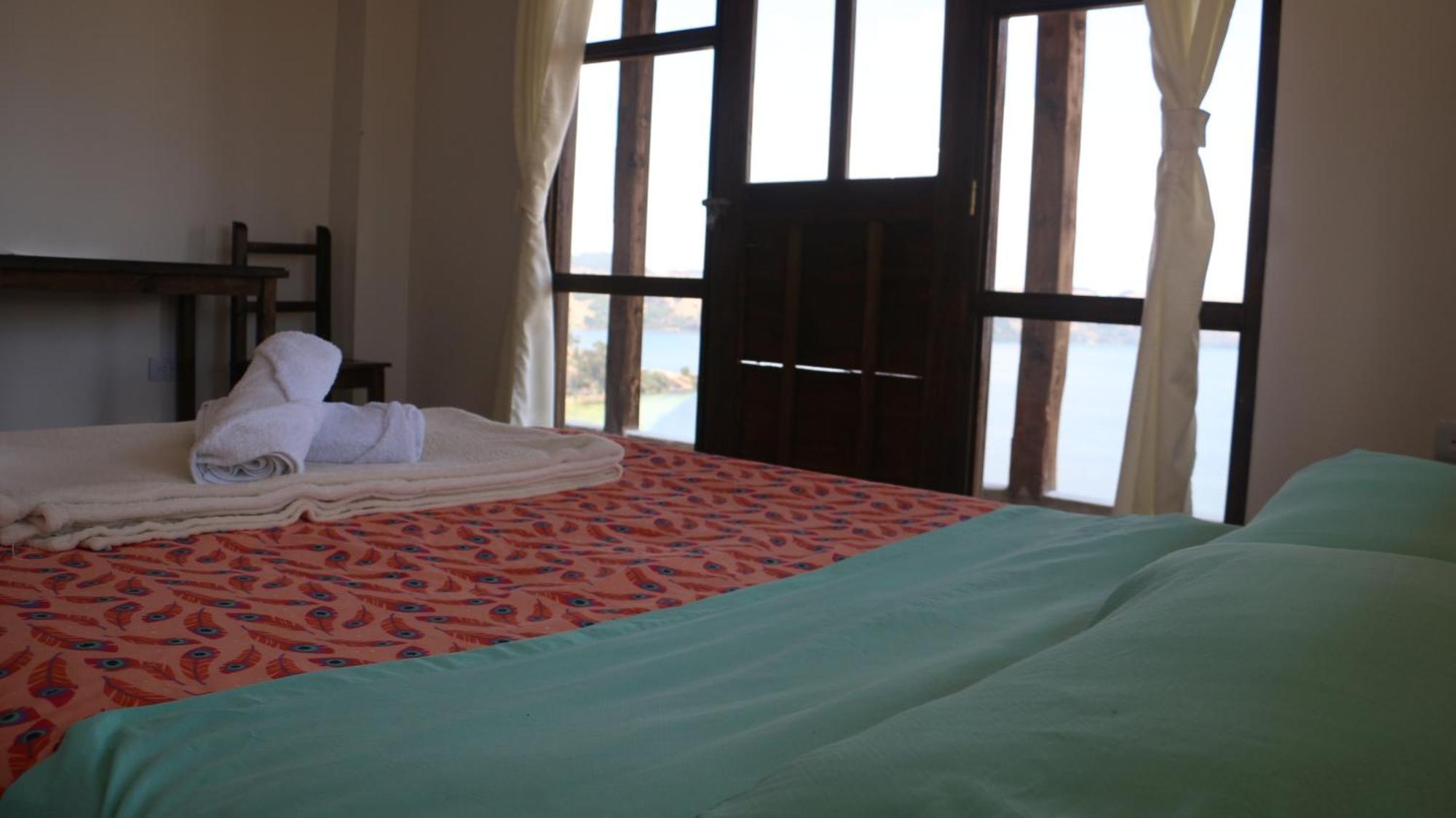 Hotel Tota Eliseo Playa Blanca Lago De トタ エクステリア 写真