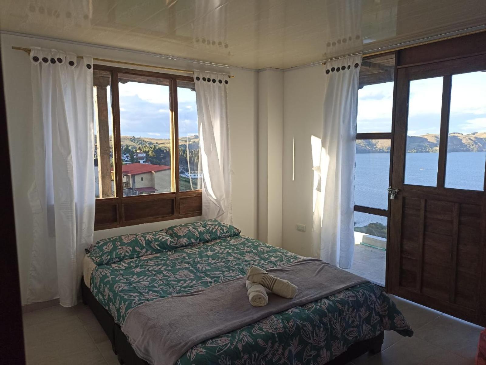 Hotel Tota Eliseo Playa Blanca Lago De トタ エクステリア 写真